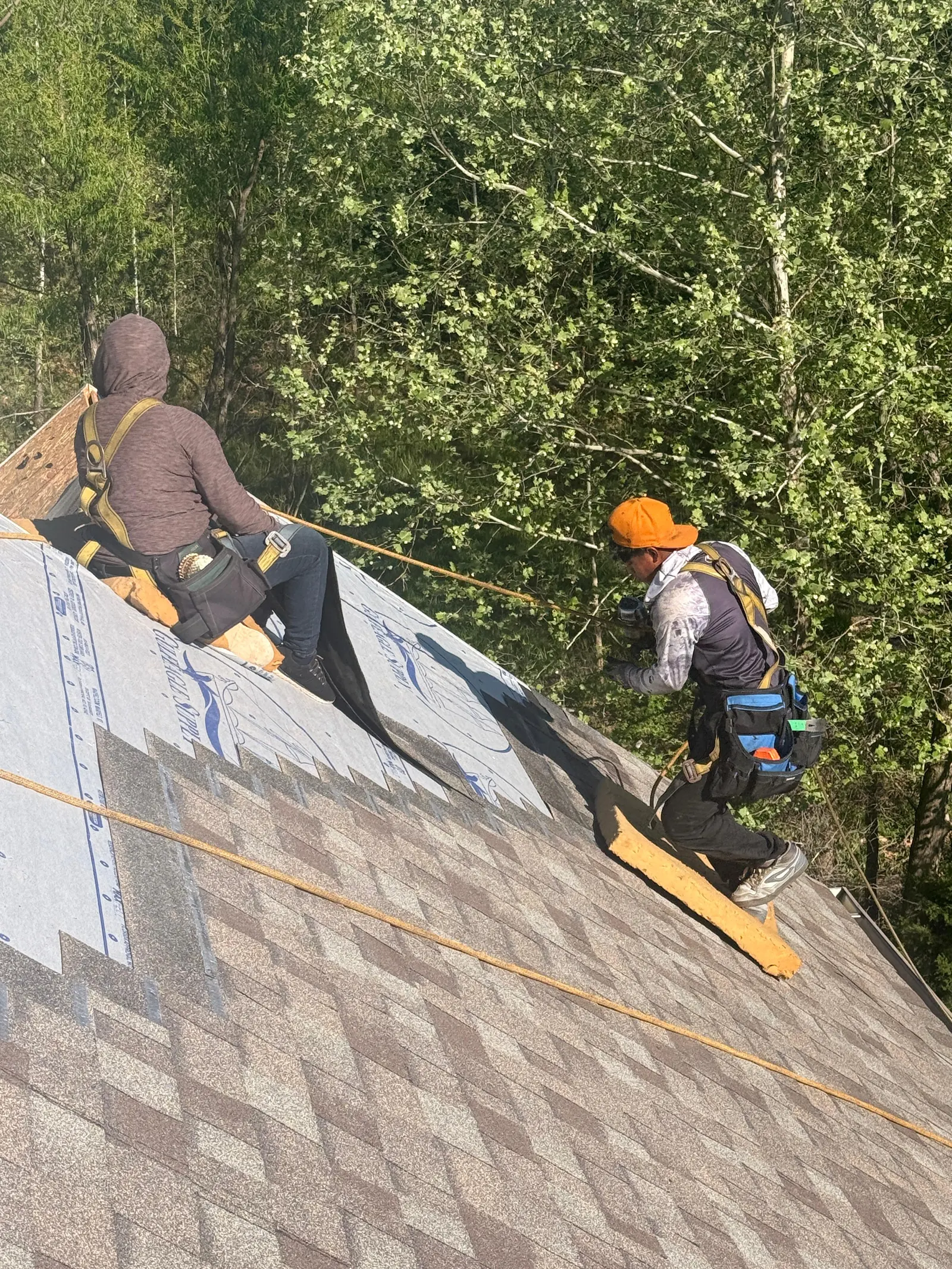 Roofing team at work