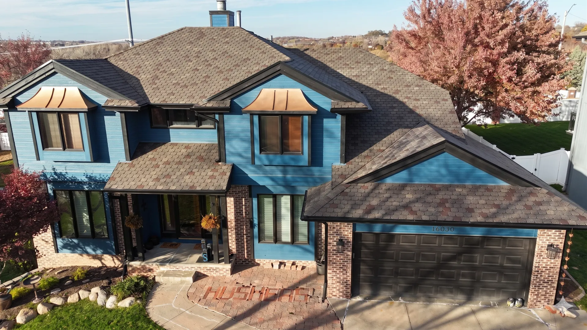 Capstone Roofing crew completing a residential project